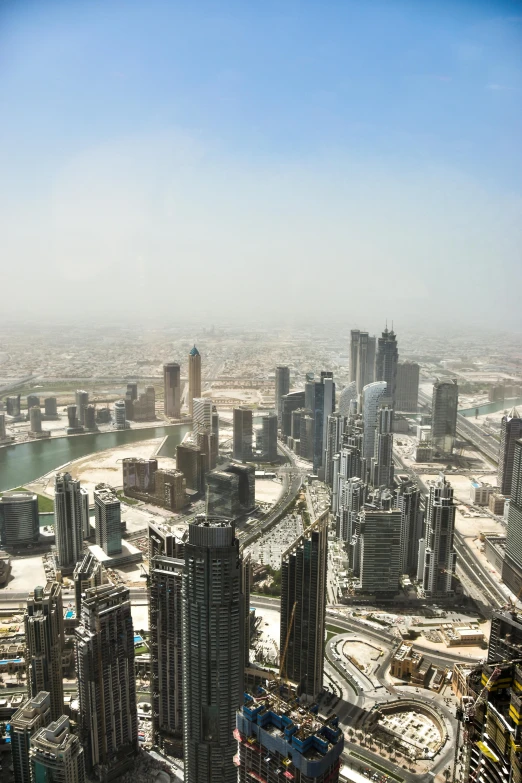 a large city with very tall buildings surrounded by a lake