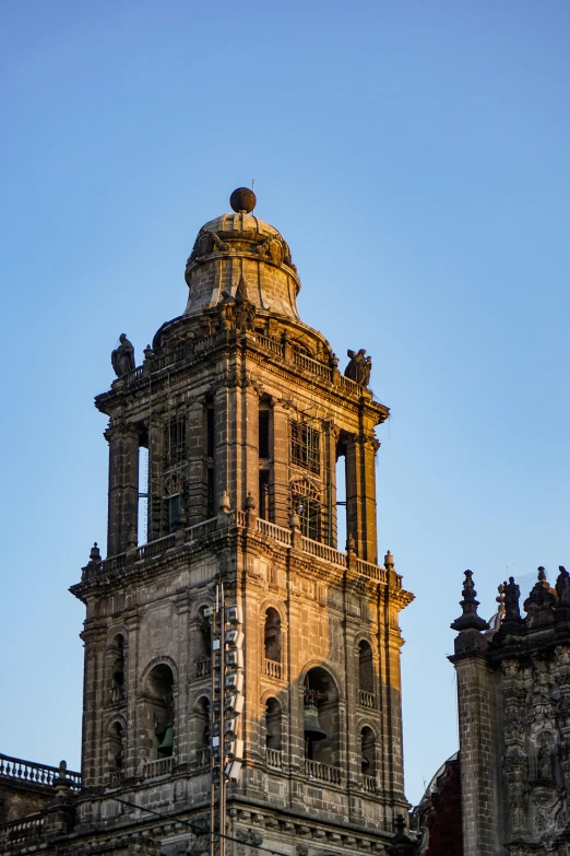 an old clock tower rises into the sky