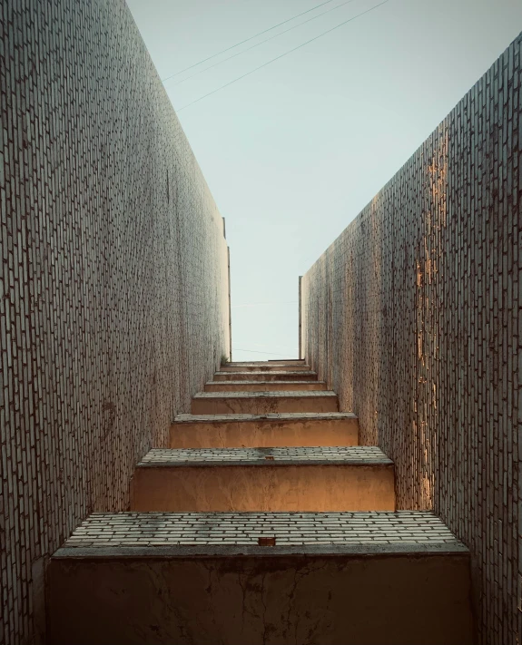 a stair case with walls that have geometric tiles on them