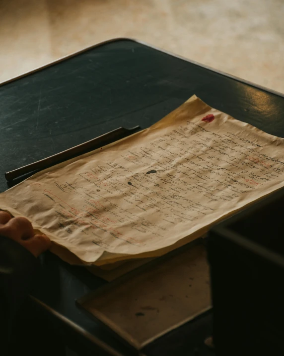 an asian writing paper lies on a desk