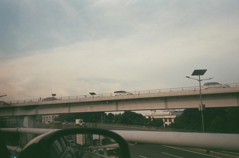 a view of a bridge above a car