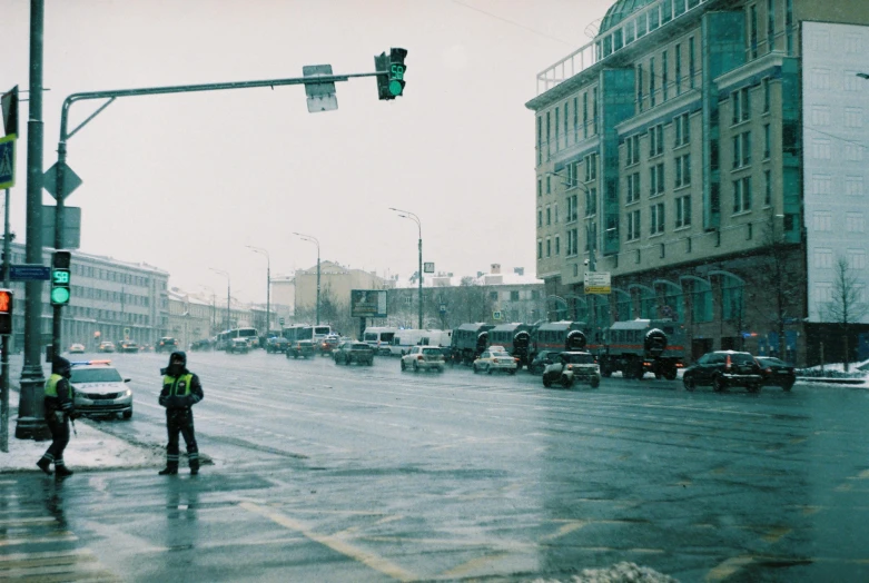 a traffic light and a person with a jacket on