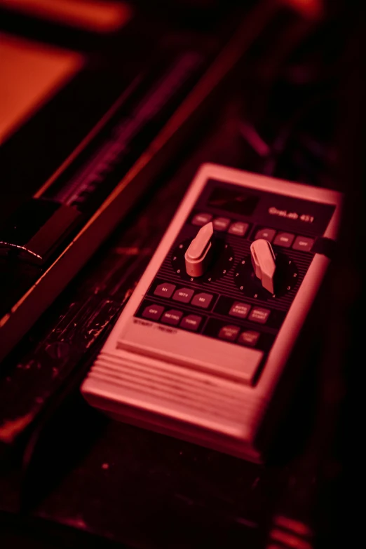 a white and black calculator some brown and red lights