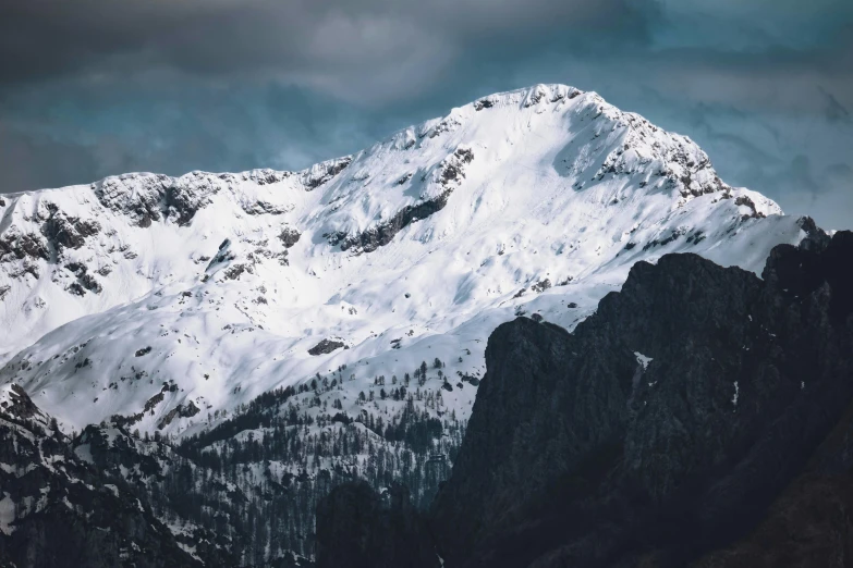 the top of a mountain with snow on it