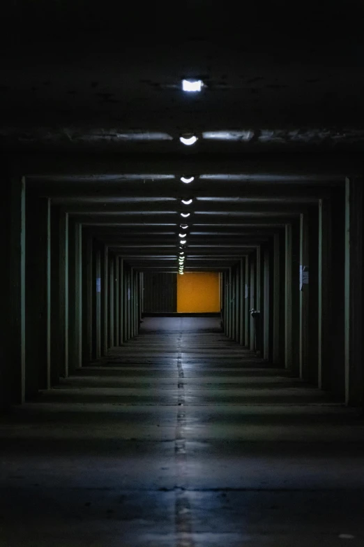 an empty parking garage with some lights on