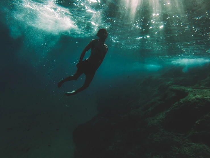 a person swimming on top of a body of water