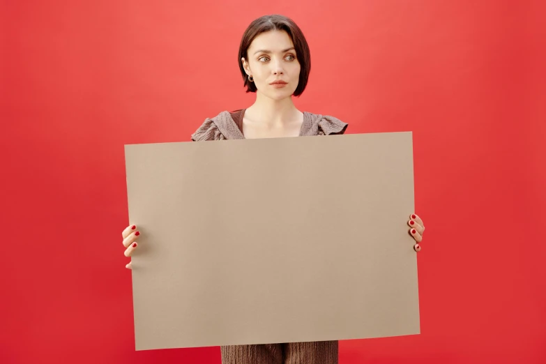 woman holding a sign that appears to be missing