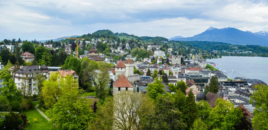 an aerial view of the town with mountains in the background