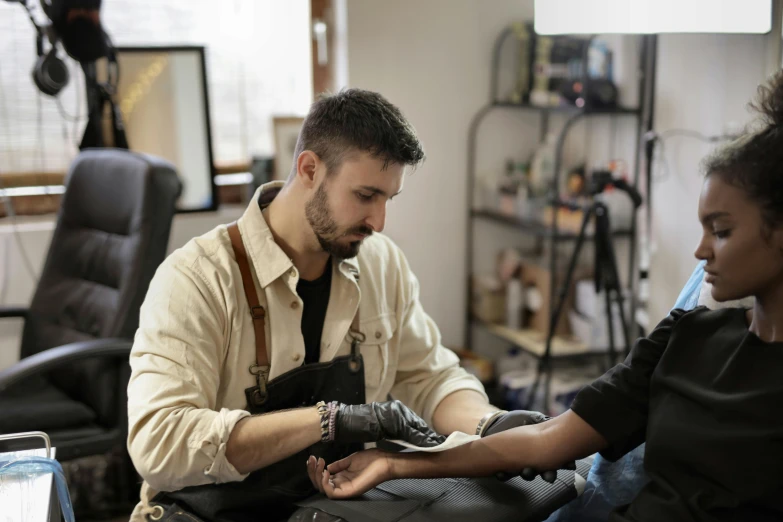 a man holds a baby and sits next to a woman