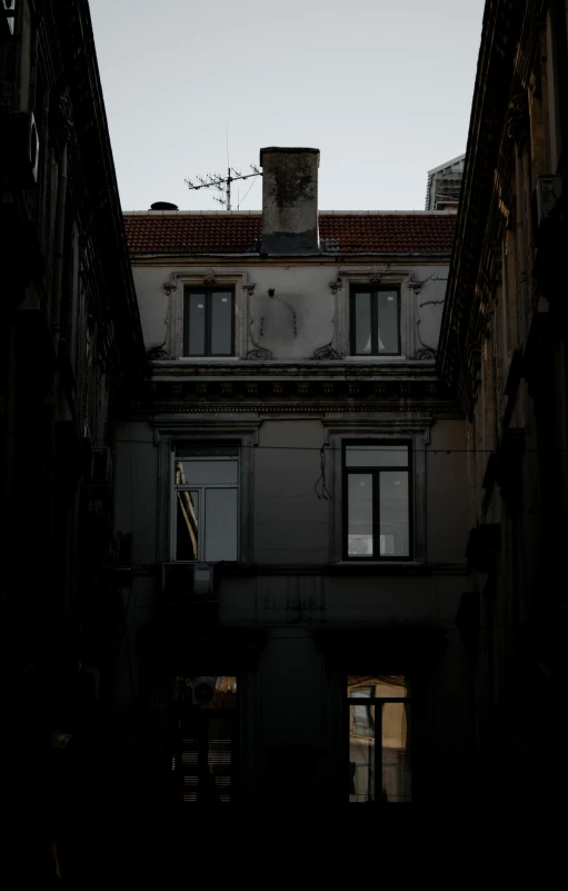 a dark building with the windows showing