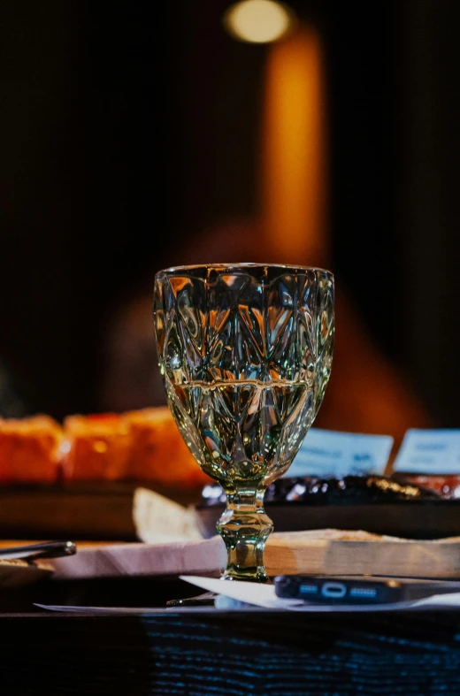 glass cup sitting on top of a wooden table