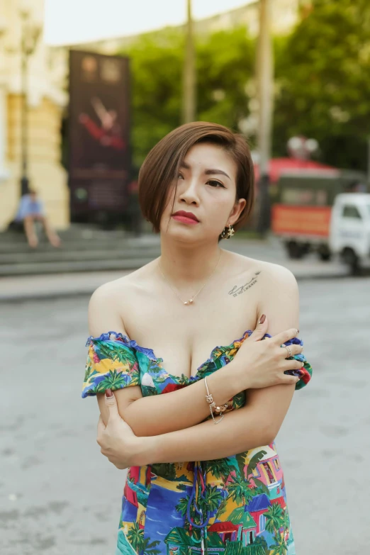 a young woman poses for a po while standing on the street