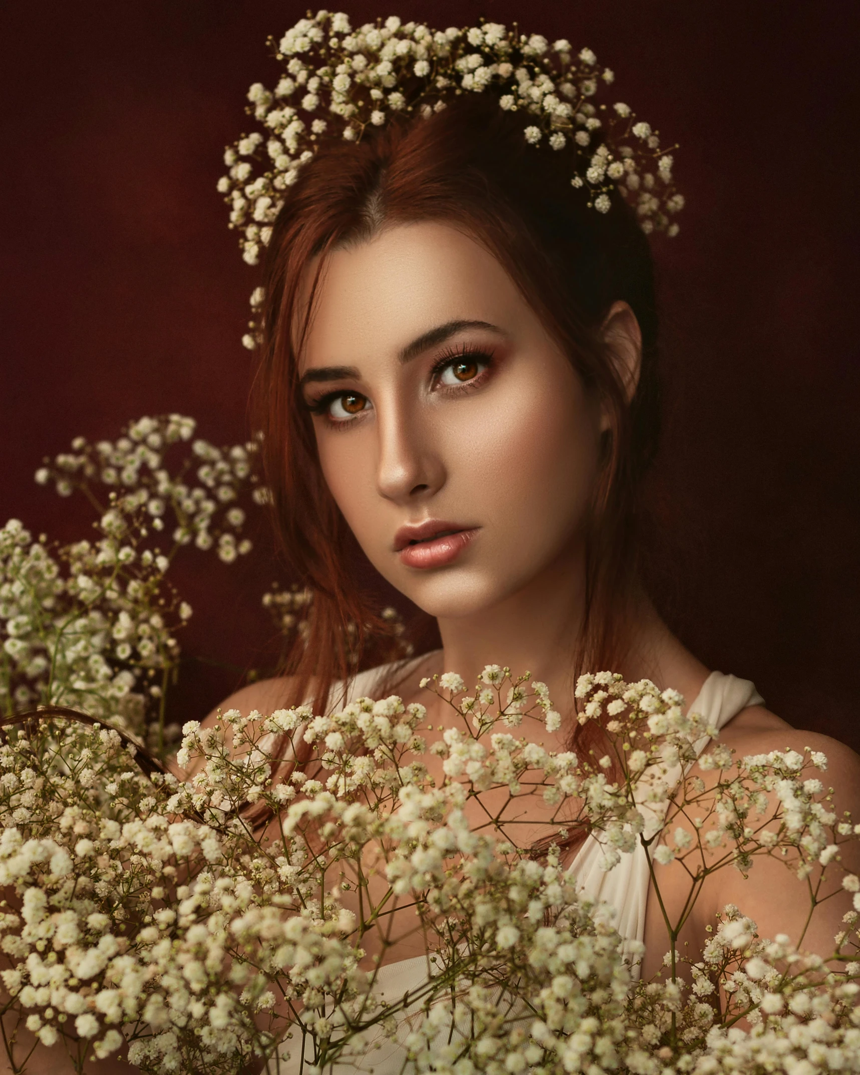 a close up of a woman wearing a white dress