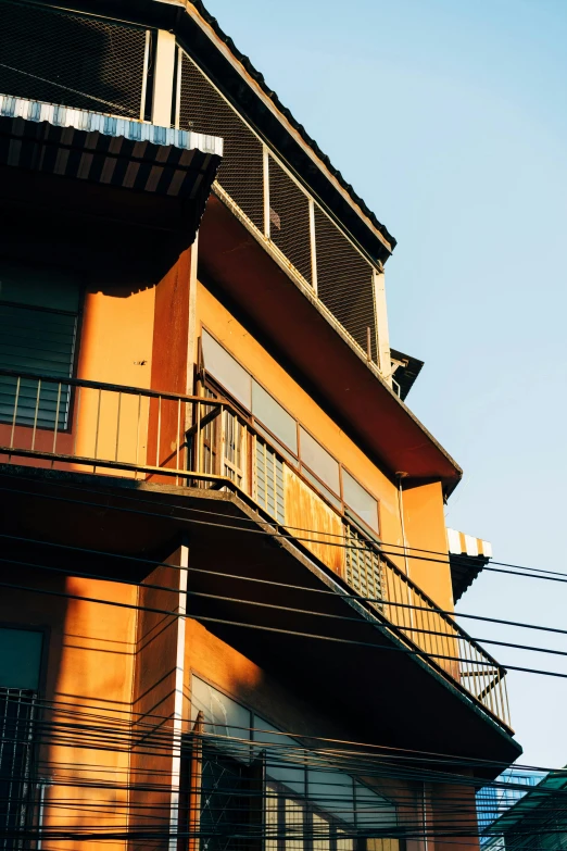 a building with an upper floor balcony and balconies