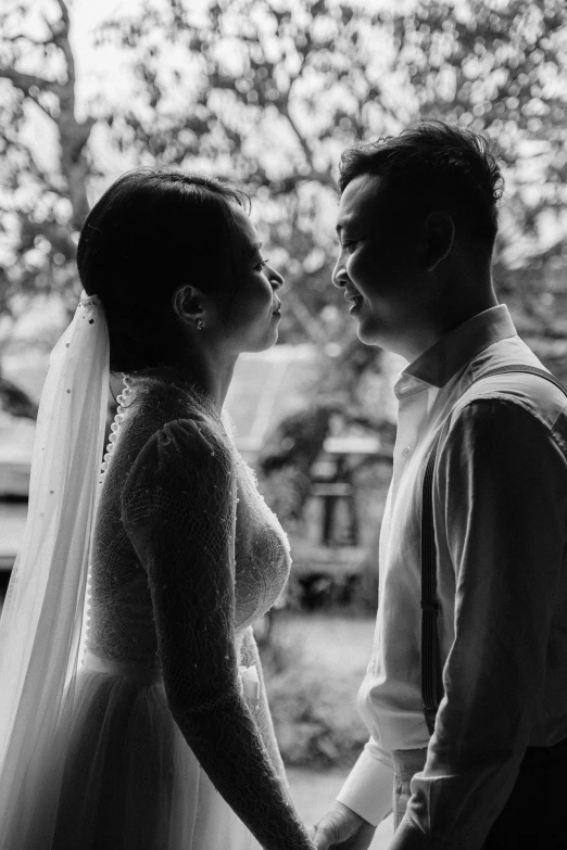 a black and white po of a bride and groom