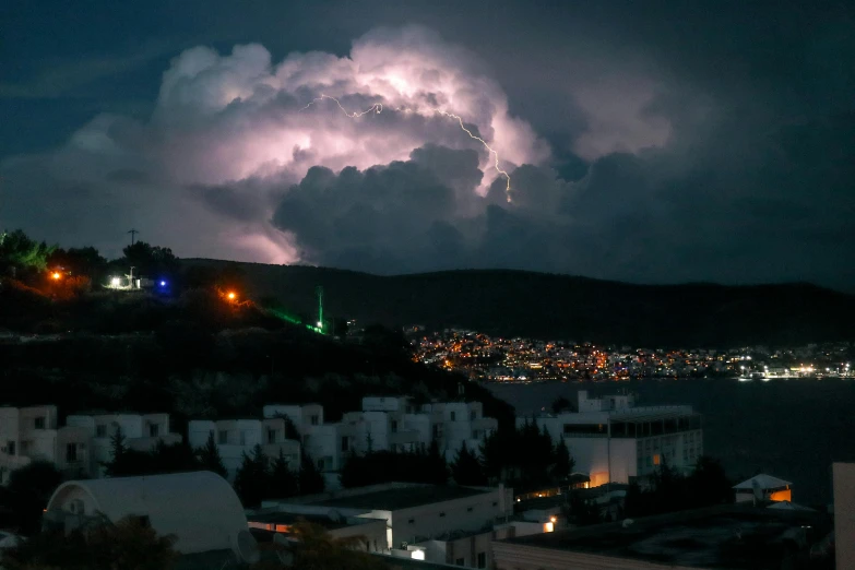 the sky is filled with fireworks as seen from a distance