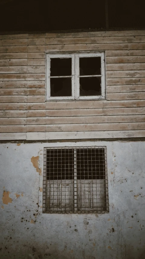 a close up of a small window on the side of a wall