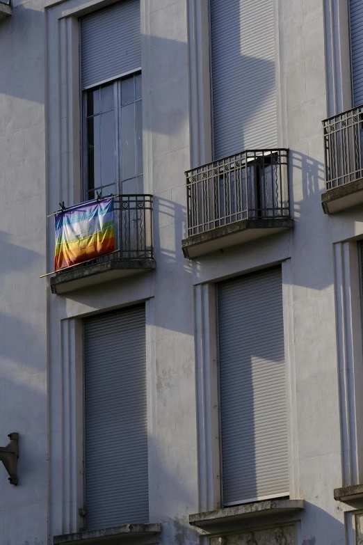 a building with some balconies and two windows