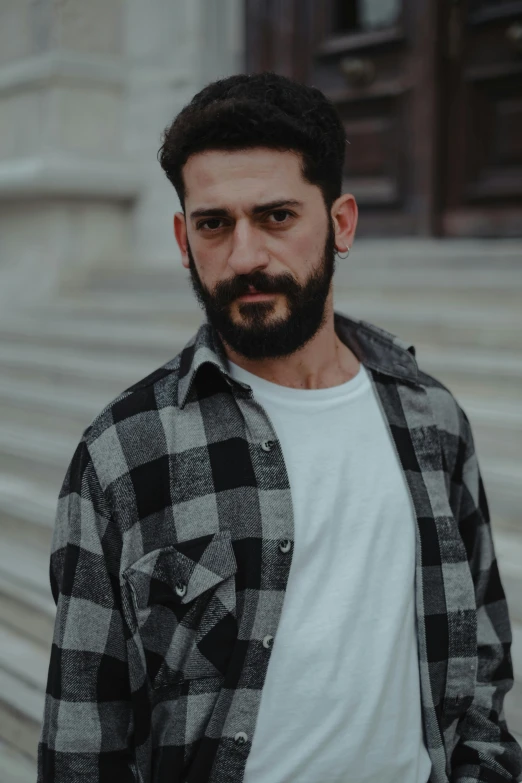 a man standing in front of some steps outside