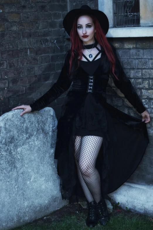 a beautiful young woman dressed up like hell doll