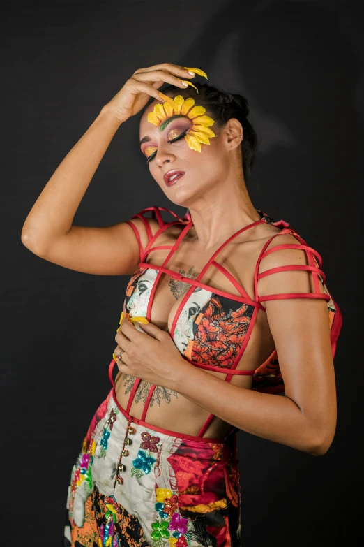 woman wearing sunflower decorated makeup and dress posing