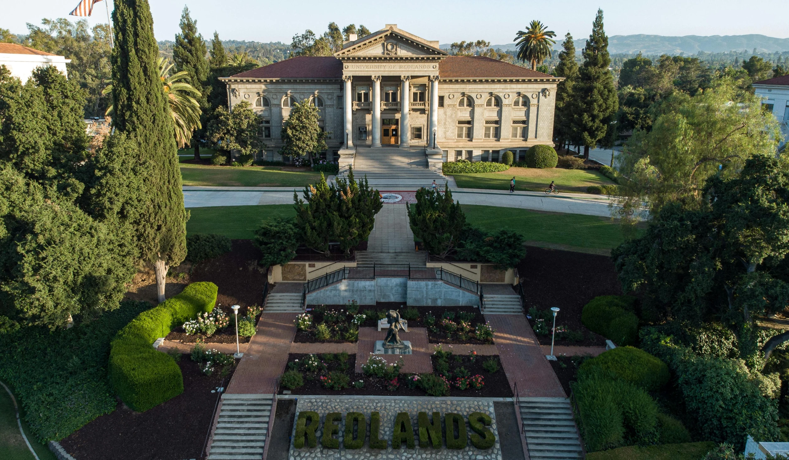 an image of a mansion with many trees around it