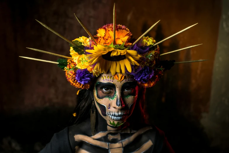 a  wearing skeleton makeup and a wreath