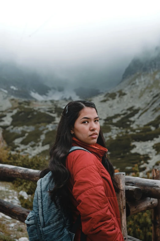 a woman with long hair wearing red clothes