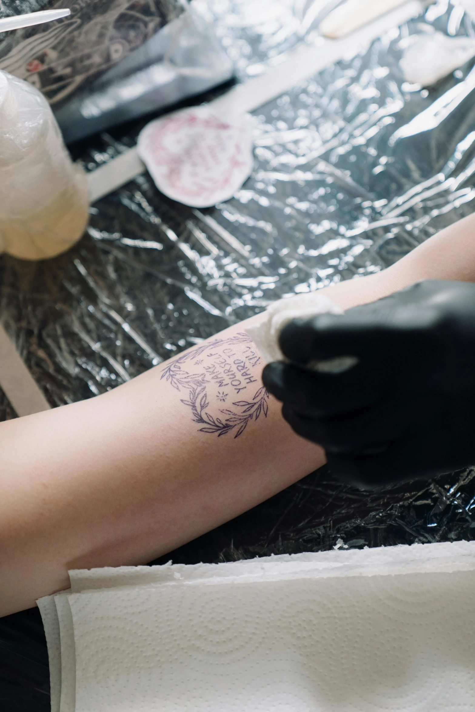 a tattoo artist has a tattoo on his arm
