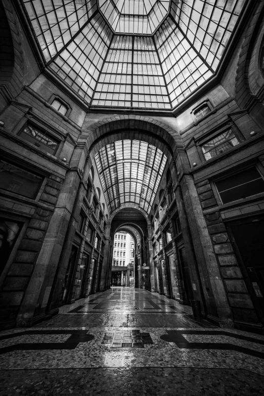 a large building has glass and metal ceilings