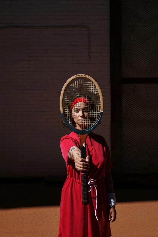 a woman with a tennis racket in her head