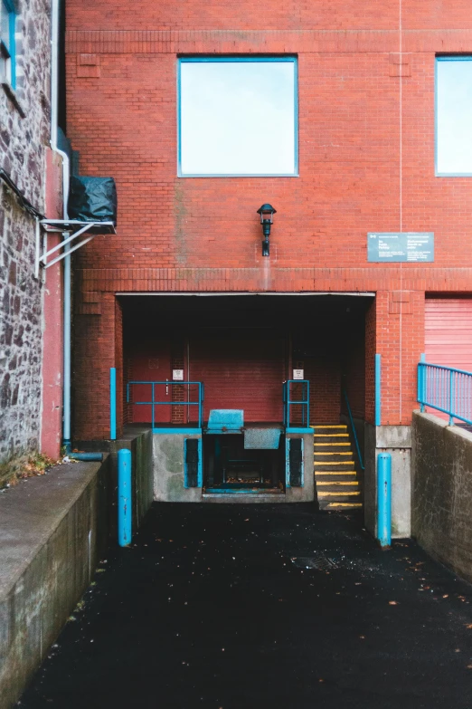 a set of steps leading to the entrance of an industrial building