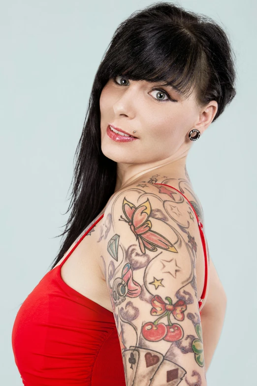 an image of a woman with a tattoo on her arm