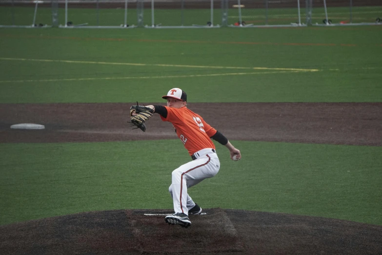 a baseball player throwing a ball during a game