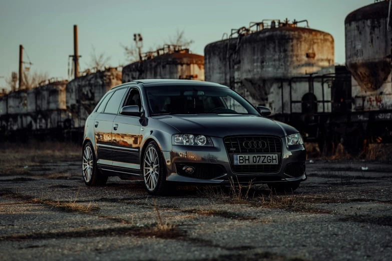 a black car in a rusty old area