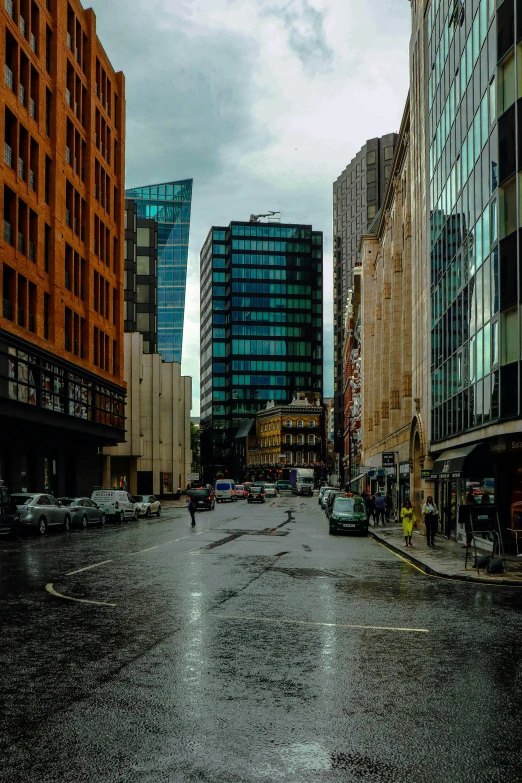 a person walking down a street in a rain storm