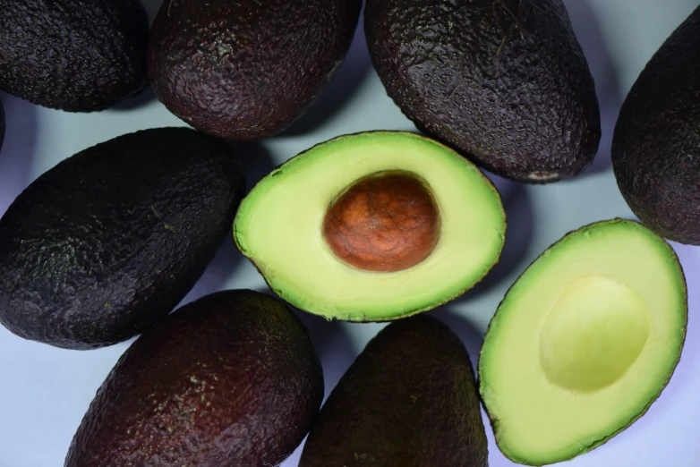 avocados on a plate with a spoon