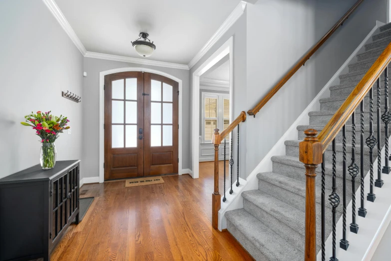 the foyer is spacious and has wooden floors