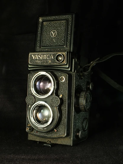 a very old camera with two cameras attached to it
