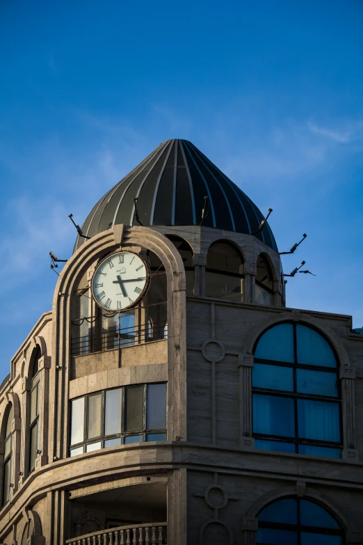 the clock on the building faces in a different time