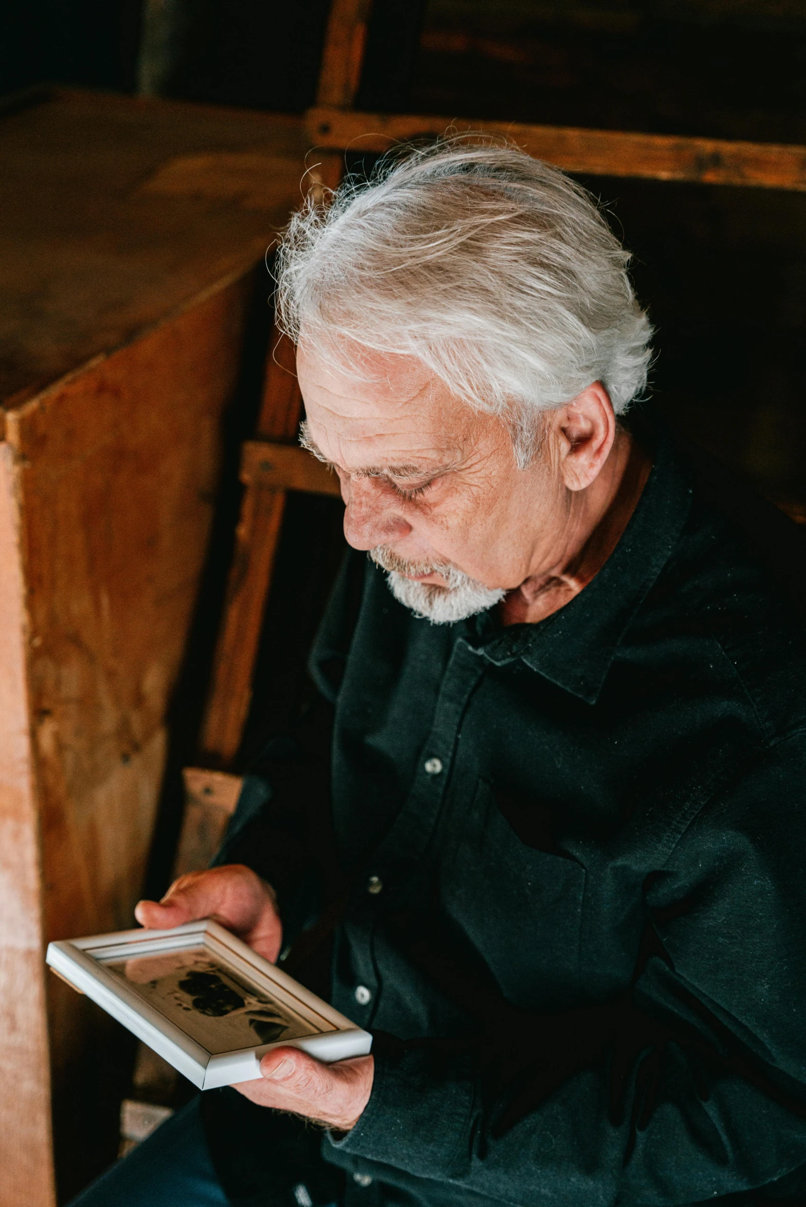 man holding an electronic device in his hands