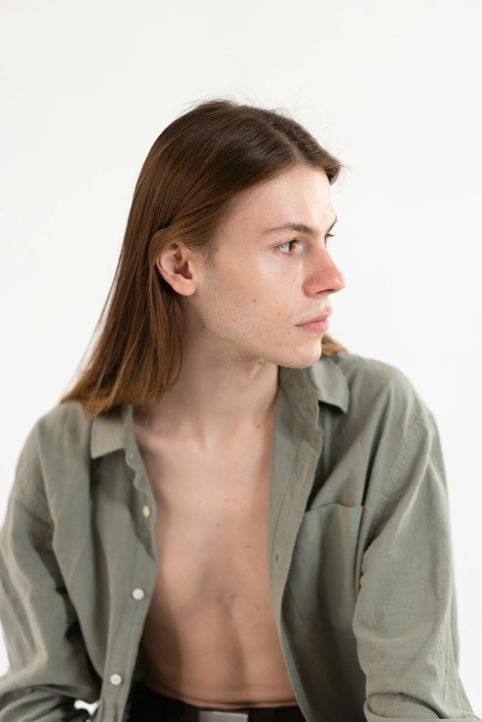 a young woman posing for the camera with very bare 