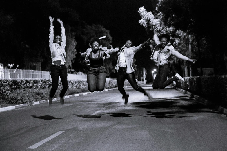 a group of people that are standing on the street