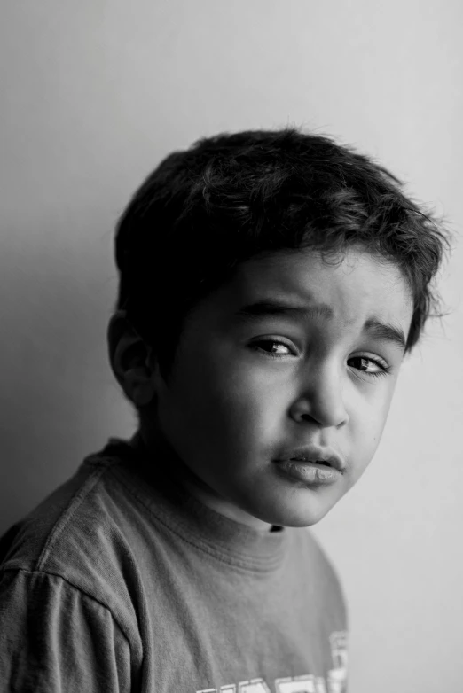 black and white po of child with messy hair