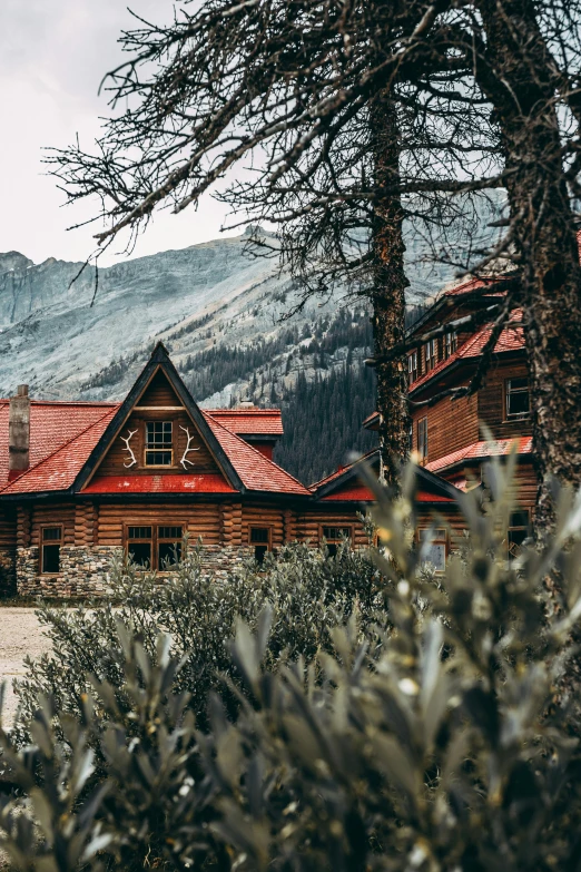 a log house with a clock on the front