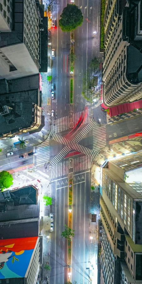 an overhead view of the city at night with bright lights