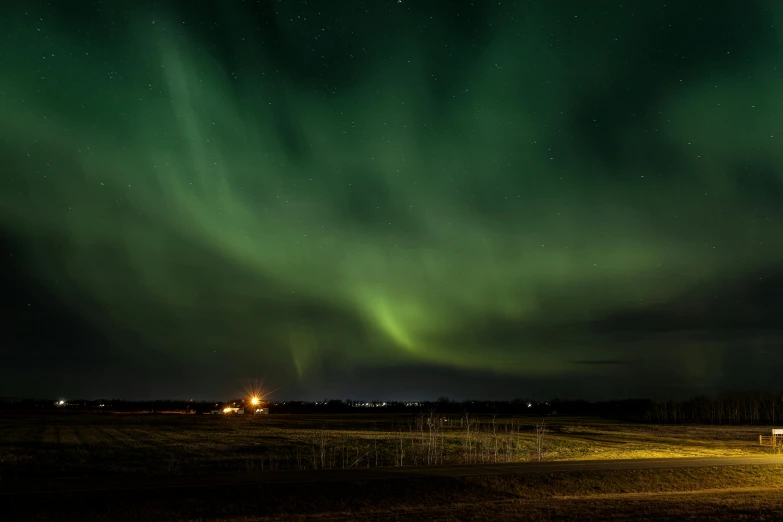 a picture of the aurora light over the prairie