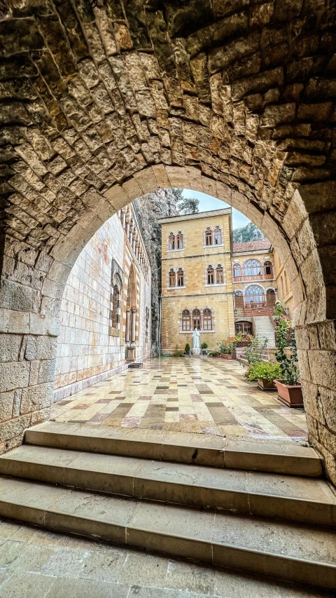 an old city street with stairs going through it