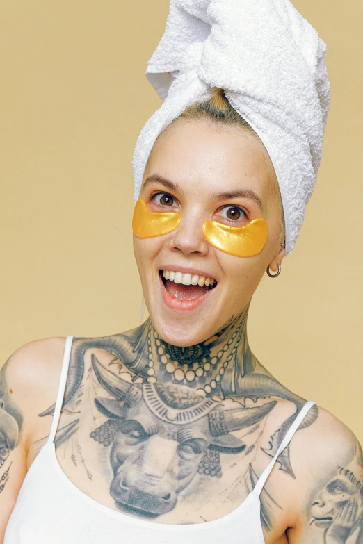 a woman is wearing some funny shaped yellow face maskes