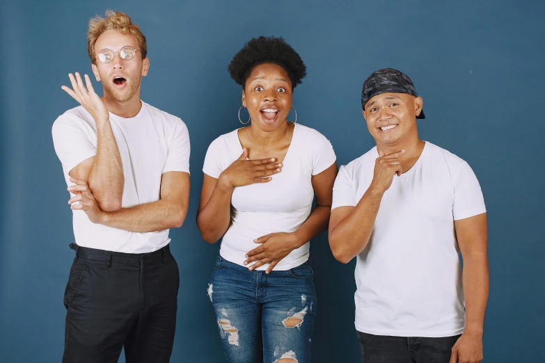 a group of four people posing for the camera